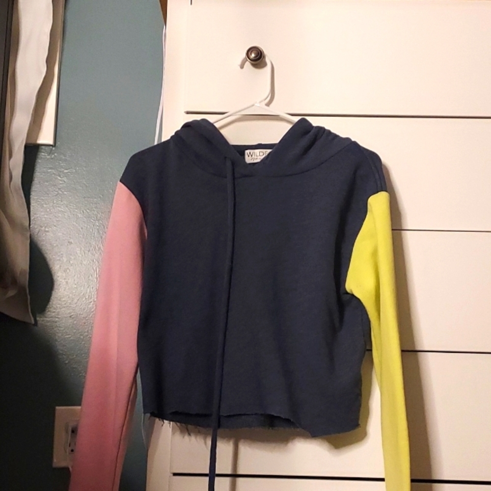 Dark blue, cropped hoodie with one green sleeve and one pink sleeve. Size L